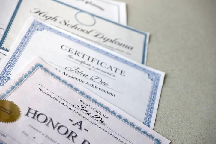 Certification documents displayed on a table