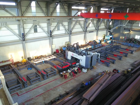 Factory layout with multiple Guanda machines and steel beams.
