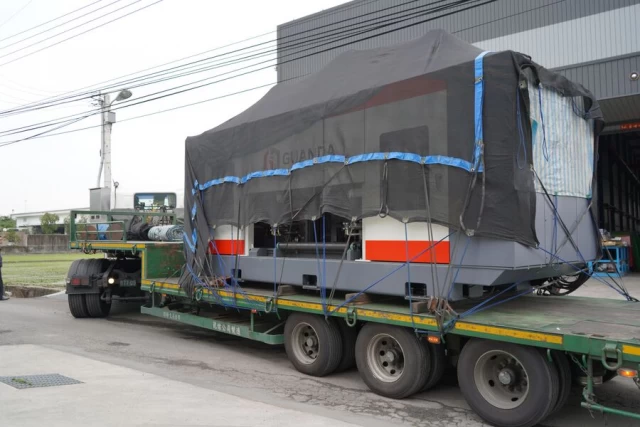 Guanda beam drilling machine on a transport truck.